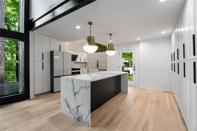 Chefs kitchen with large island, quartz countertop