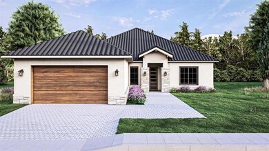 View of front of home featuring stone siding, stu