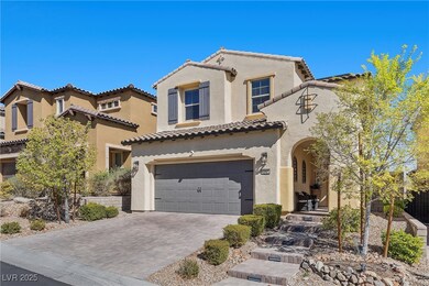 Mediterranean / spanish-style house featuring a ti
