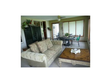 Sun Room spans the rear of house and has windows o