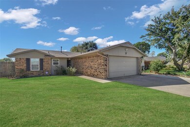Ranch-style house featuring a garage and a front l
