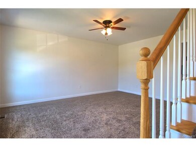 Spacious family room with ceiling fan