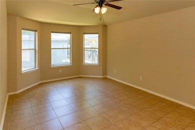 Unfurnished room with light tile patterned floori