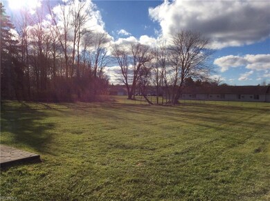 Large fenced in backyard with patio
