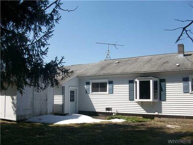 Exterior Back. Rear view of home showing shed, bac