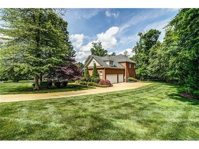 Side yard with thick lawn and long, flat aggregate