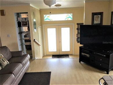 ENTRY WAY AND PART OF THE LIVING ROOM