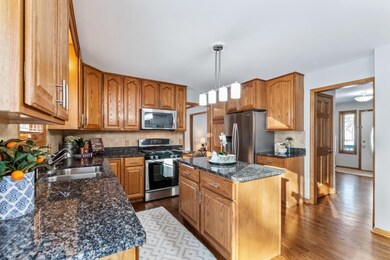 Kitchen has granite & stainless steel appliances
