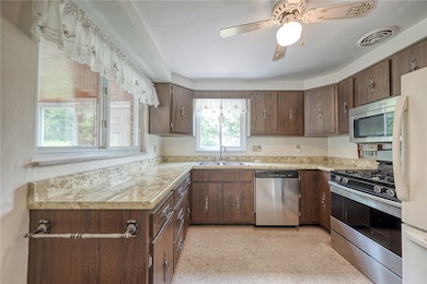 The kitchen has a newer stainless gas stove, built