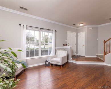 Open Living Room w/ Crown Molding