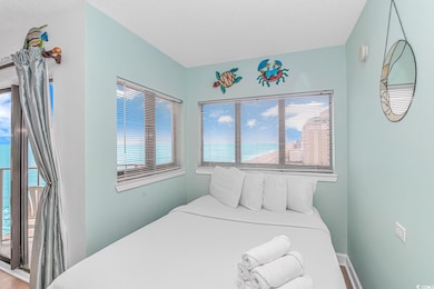 Bedroom with baseboards and multiple windows