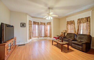 Bright family room with stunning bay windows.