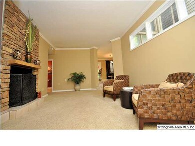 Living room with rock fire place that can be seen 