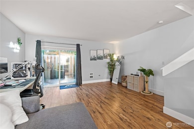 The open-concept living area gives you the flexibility to utilize the space however you like. Imagine setting up a dining area, a cozy living room, or a TV space for entertainment—all within view of the kitchen. This bright and versatile layout is perfect for gatherings and welcoming guests.