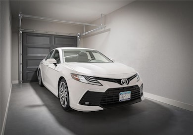 Garage featuring baseboards