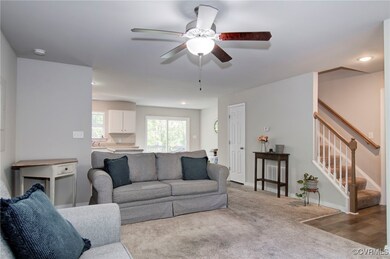 Living room with light wood-type flooring and ceil