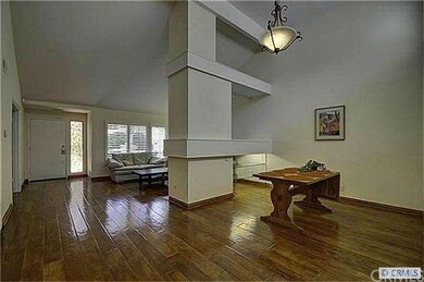 Distressed hardwood flooring throughout