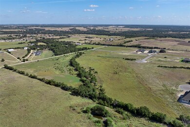 Aerial view of property's location featuring rural landscape
