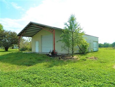 Seven year old metal shop building with two over h