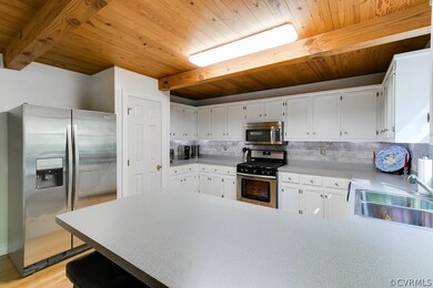 Another view of the kitchen showing the pantry, ne