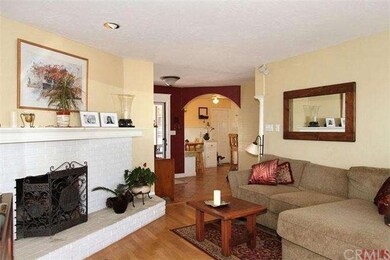 Cozy wood burning fireplace warms the living room