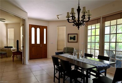 Dining area featuring light tile patterned floors,