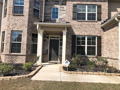 Property entrance with brick siding
