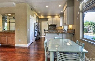 Kitchen flows nicely into large breakfast nook wit