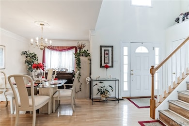 Entryway featuring a high ceiling, an inviting cha