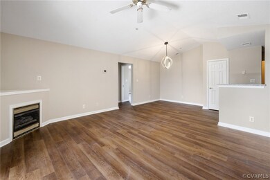 Unfurnished living room with vaulted ceiling, dark