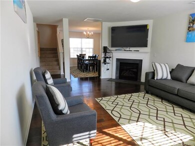 Entrance & Living Room with fireplace and big scre