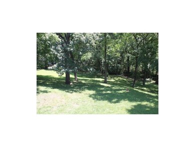 Admire this beautiful fenced backyard from many ro