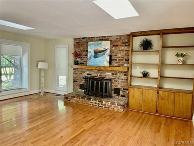 Bright family room with windows and skylights. Har