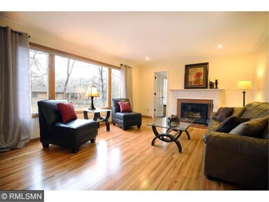 Living room offers wall of windows with abundant n