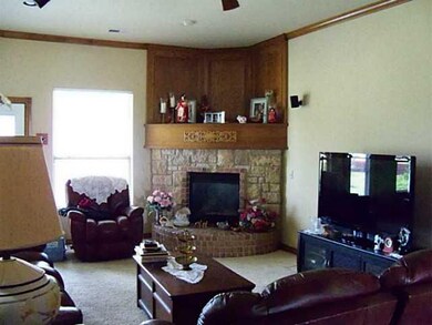 Exterior Front. Beautiful fireplace place, crown molding, ceiling fans, wired for surround sound.