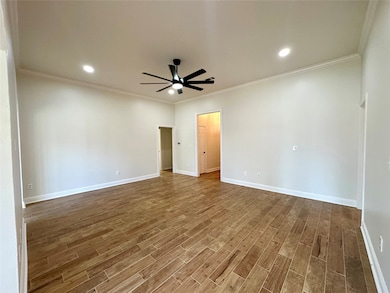 Unfurnished room with crown molding, recessed lighting, ceiling fan, and dark wood finished floors