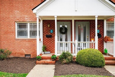 Doorway to property featuring crawl space, a porch