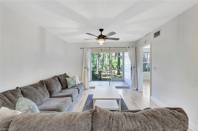 Living area featuring baseboards, ceiling fan, and light wood-style flooring