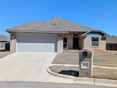 Ranch-style house featuring roof with shingles, br
