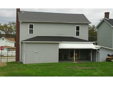 Exterior Back. 2 covered porches, no maintenance v