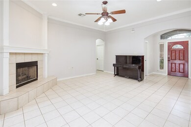 Unfurnished living room with ceiling fan, arched w