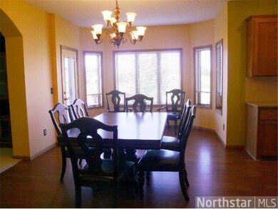 Large dining area with bay window overlooks deck a