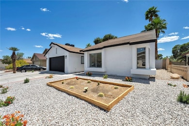 View of front of property with fence, stucco sidin