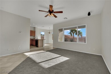 Unfurnished living room featuring a chandelier, ce