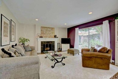 Recessed lighting, fireplace and glass slider that