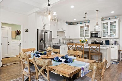 Dining and kitchen area, facing laundry room and g