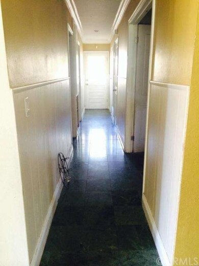 Hallway leading to bedrooms and backyard.
