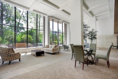 This spacious, modern room features large windows