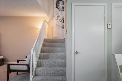 Stairway to upstairs bedrooms, note the door to un