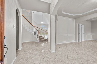 Step inside this masterpiece into a grand entryway